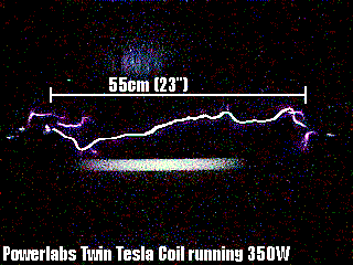 A power arc between the two towers of the Twin Tesla Coil system. The light on the background is lit by the electric field alone. Click on picture to download video (2mB)