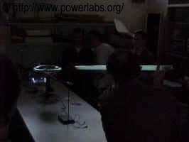 Mr. Carah attempts to get the light struck by the Tesla Coil.