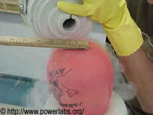 Nitrogen is poured over the baloon to make it shrink to a size that will fit the LN2 container.