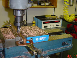 Milling the edges off both rails at once on the digital readout servo assisted milling machine.