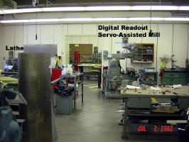 Lathe, servo, assisted digital readout mill. To the left is the welding booth.