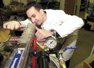  This picture was on the cover of a Michigan Newspaper in Jan '04. It shows me adjusting the bolts on the railgun.