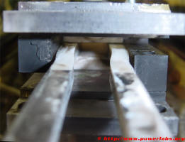 Buckled Teflon rail insulators around breech of the Rail Gun.