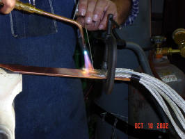 Silver soldering all the wires to one of the capacitor bank busbars.