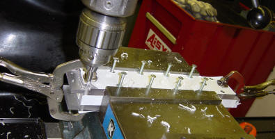 Countersinking holes for projectile injector.