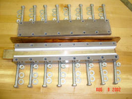 Open rail enclosure showing the rails, teflon spacers, bolts, nuts, washers and plates that keep everything together.