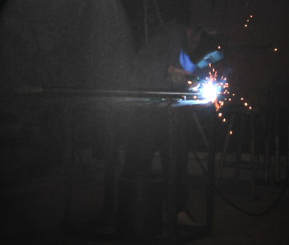 Welding the pipe.